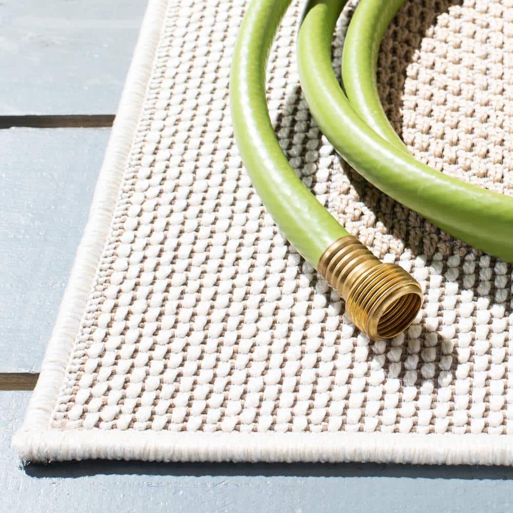 Ivory and Beige Synthetic Runner Rug, 9' x 2'2"