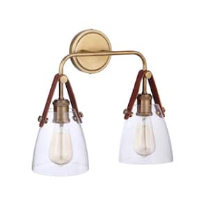 Hagen 16 in. 2 -Light Vintage Brass Finish Vanity Light with Crystal Clear Glass Suspended from Genuine Leather Strap