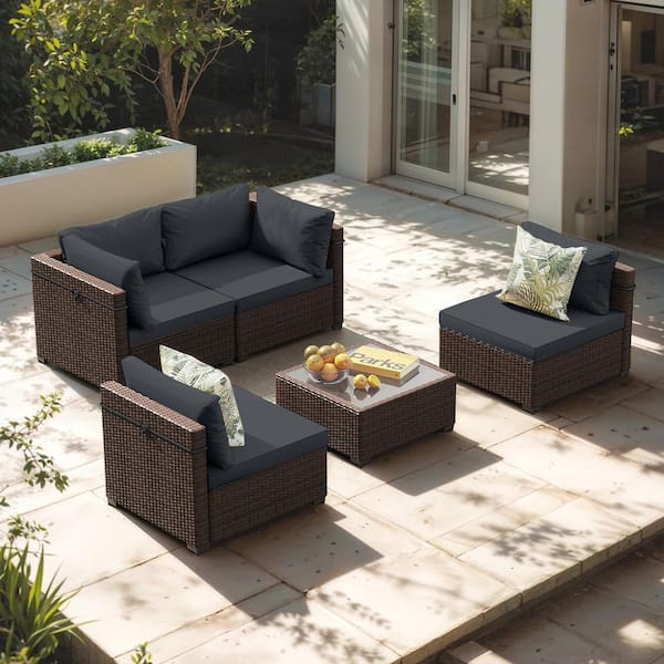 5-Piece Brown Wicker Sectional Seating Group with Coffee Table and Dark gray Cushions