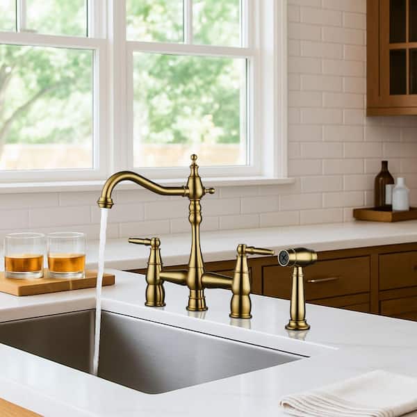 4 Hole Double Handle Bridge Kitchen Faucet with Side Sprayer Deck Mount in Gold