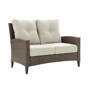 Rockport Wicker Outdoor Loveseat with Oatmeal Cushions