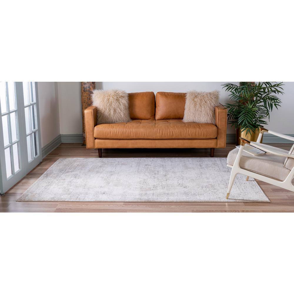 Ivory and Gray Geometric Synthetic 6' x 9' Area Rug