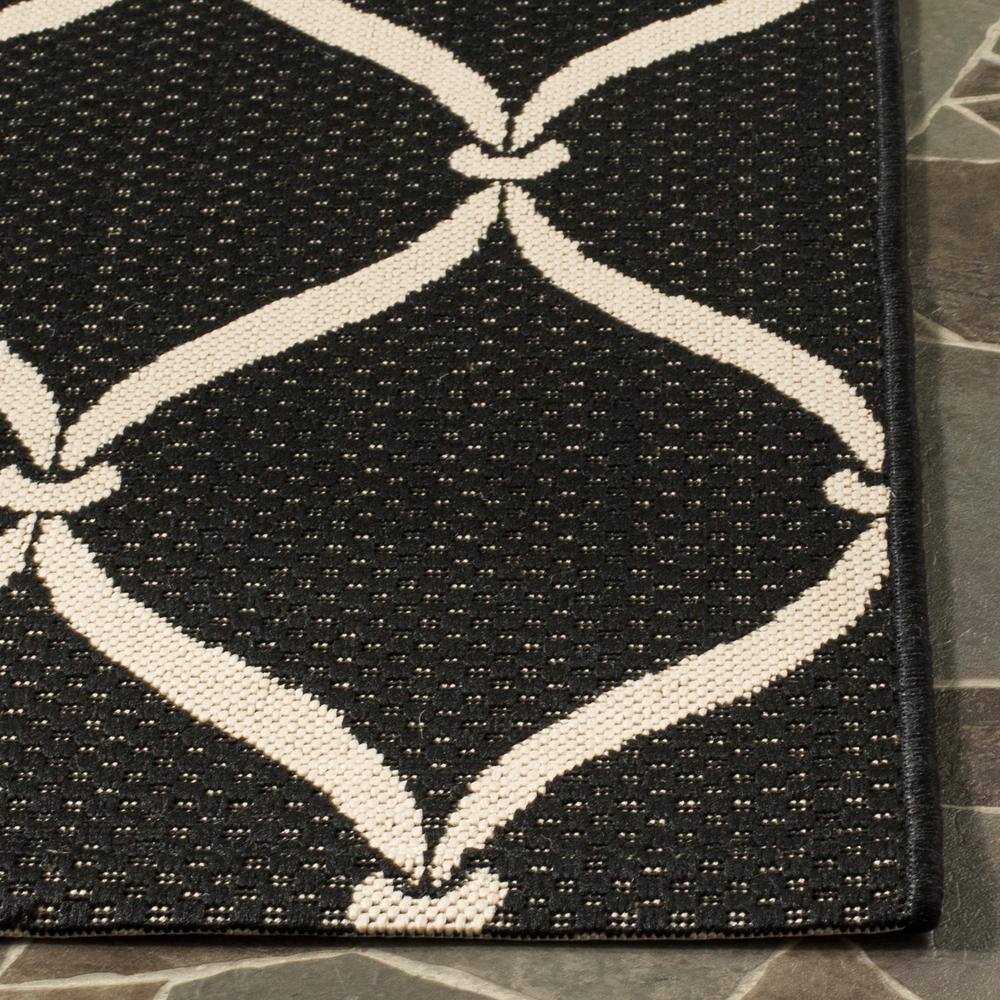 Black and Beige Geometric Indoor/Outdoor Area Rug 4' x 5'7"