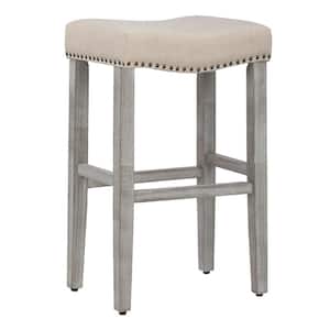 Jameson 29 in. Bar Height Antique Gray Wood Backless Nailhead Trim Barstool with Upholstered Beige Linen Saddle Seat