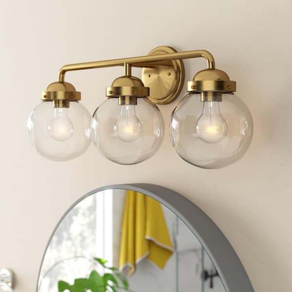 Knoll 24 in. 3-Light Brushed Gold Retro Vanity Light with Clear Glass Shades