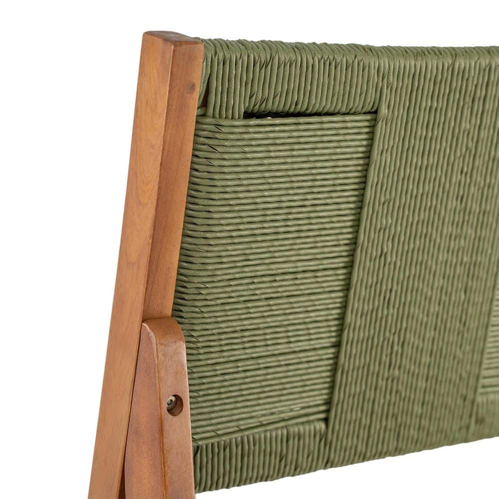 Close-up detail of the green wicker texture on a bar stool backrest.