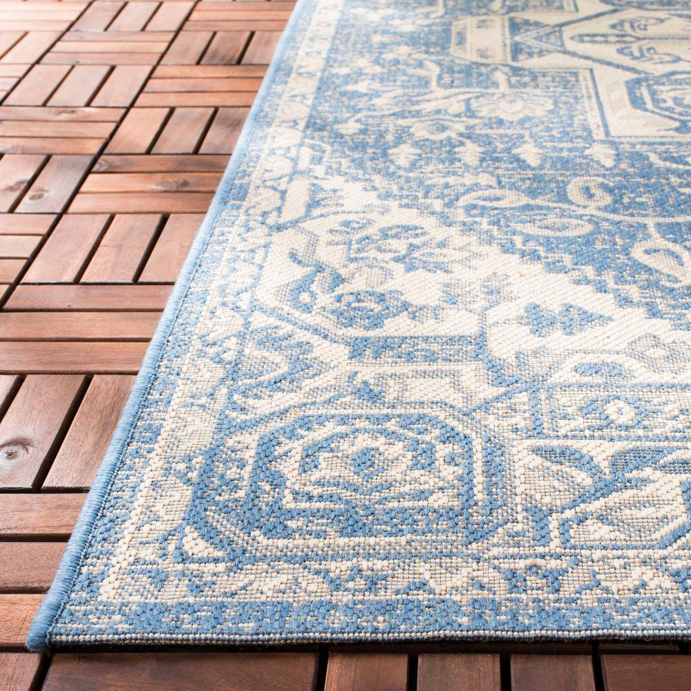 Cream and Blue Synthetic Medallion Indoor/Outdoor Area Rug