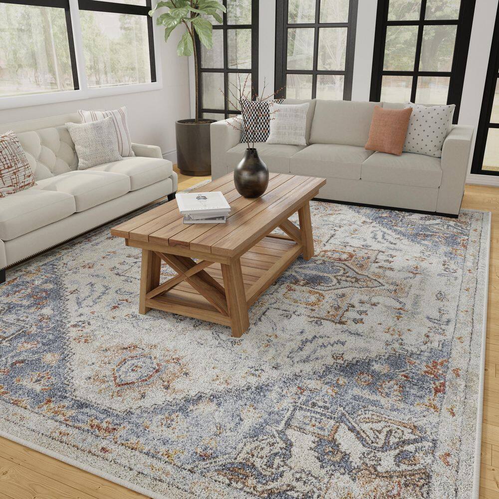 Cream and Blue 6' x 9' Synthetic Oriental Area Rug