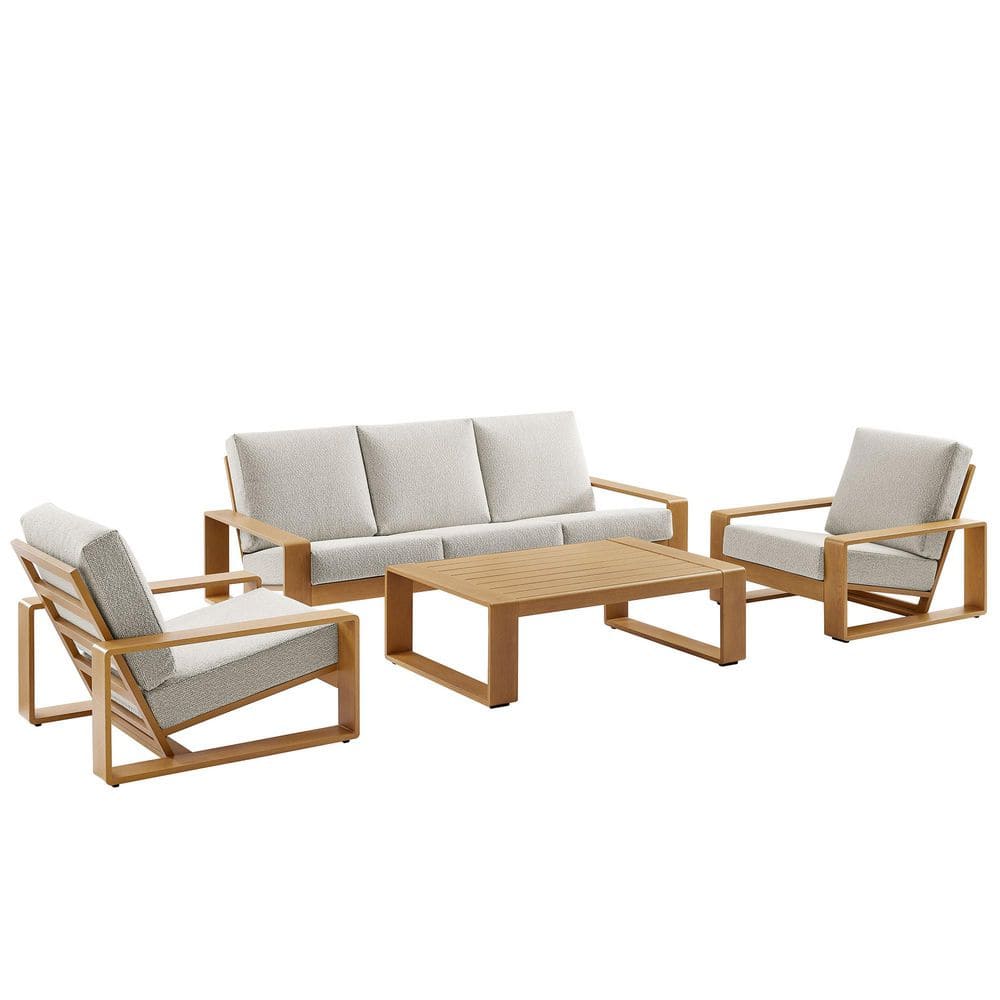 A four-piece outdoor furniture set including a sofa, two chairs, and a coffee table.