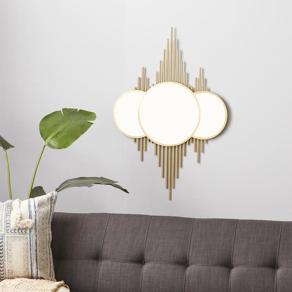 CosmoLiving by Cosmopolitan 39 in. x 27 in. Round Framed Gold Wall Mirror