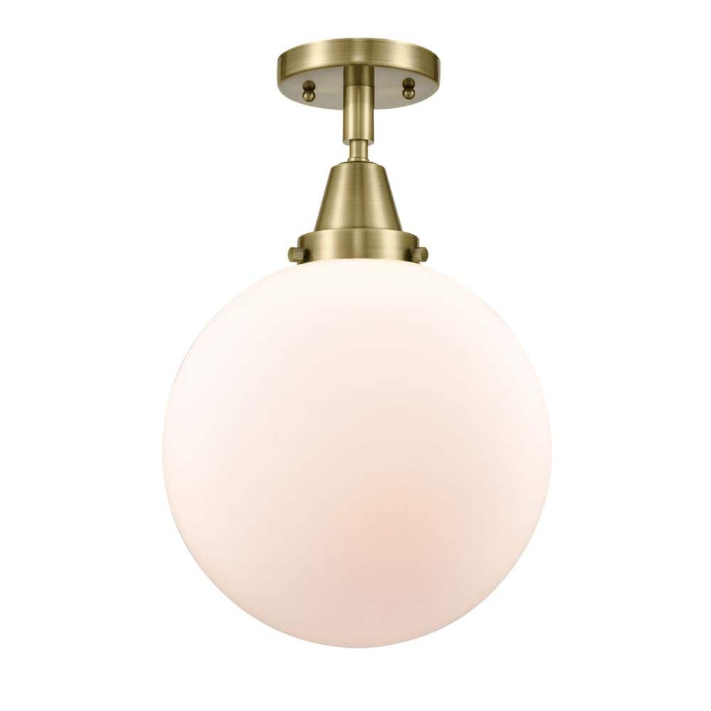 Beacon 10 in. 1-Light Antique Brass Industrial Flush Mount with Seeded Glass Shade price history on PriceWatchPro