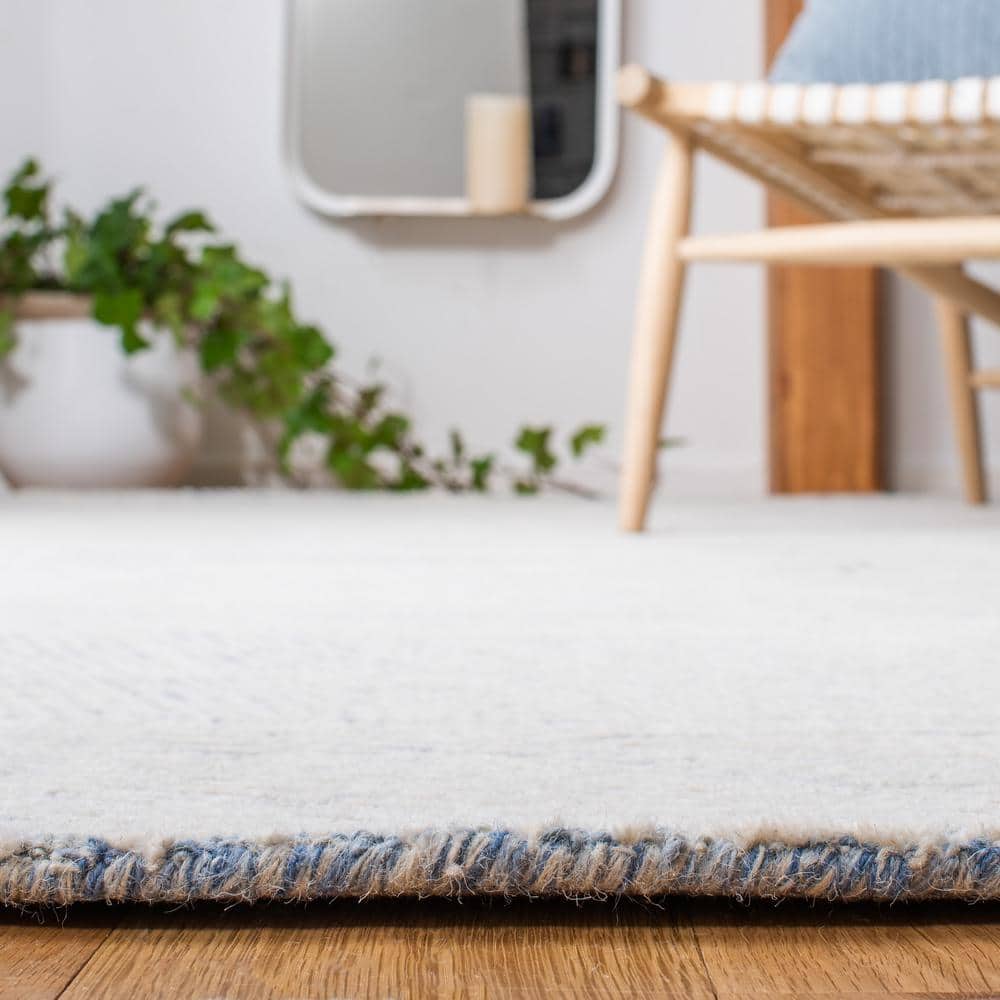 Blue and Ivory Floral Hand-Tufted Wool Area Rug, 5' x 8'
