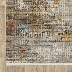 4' X 6' Beige Grey Brown Gold Red And Blue Abstract Power Loom Stain Resistant Area Rug With Fringe