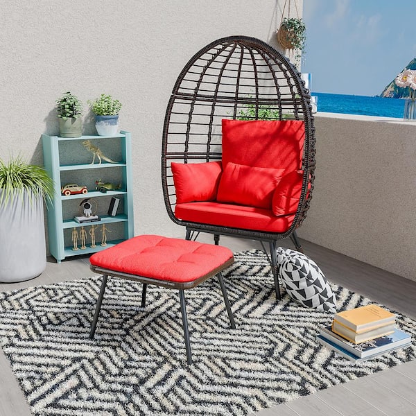 Oversized Outdoor Wicker Egg Chair with Red Cushions and Footrest