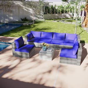 7-Piece Wicker Outdoor Sectional Set with Navy Blue Cushions and Coffee Table