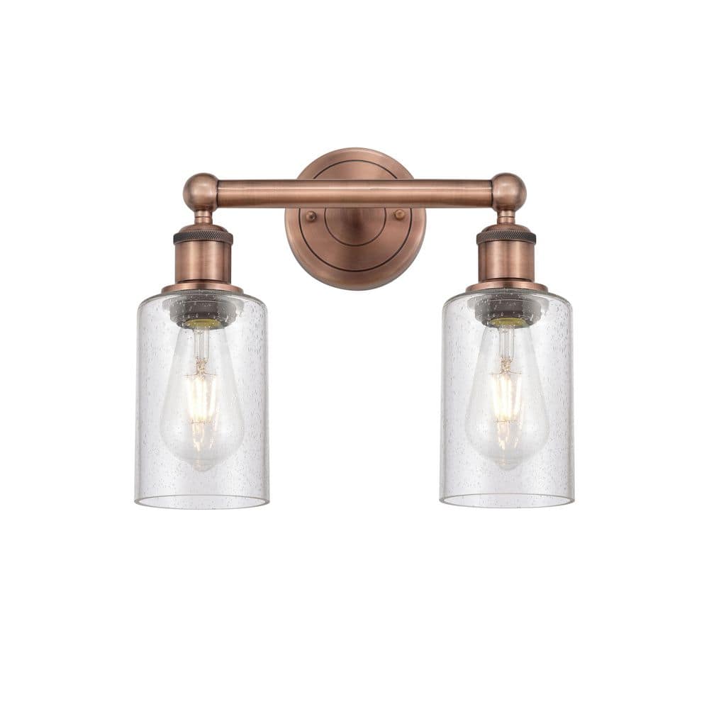 Clymer 12.88 in. 2-Light Antique Copper Vanity Light with Glass Shade price history on PriceWatchPro