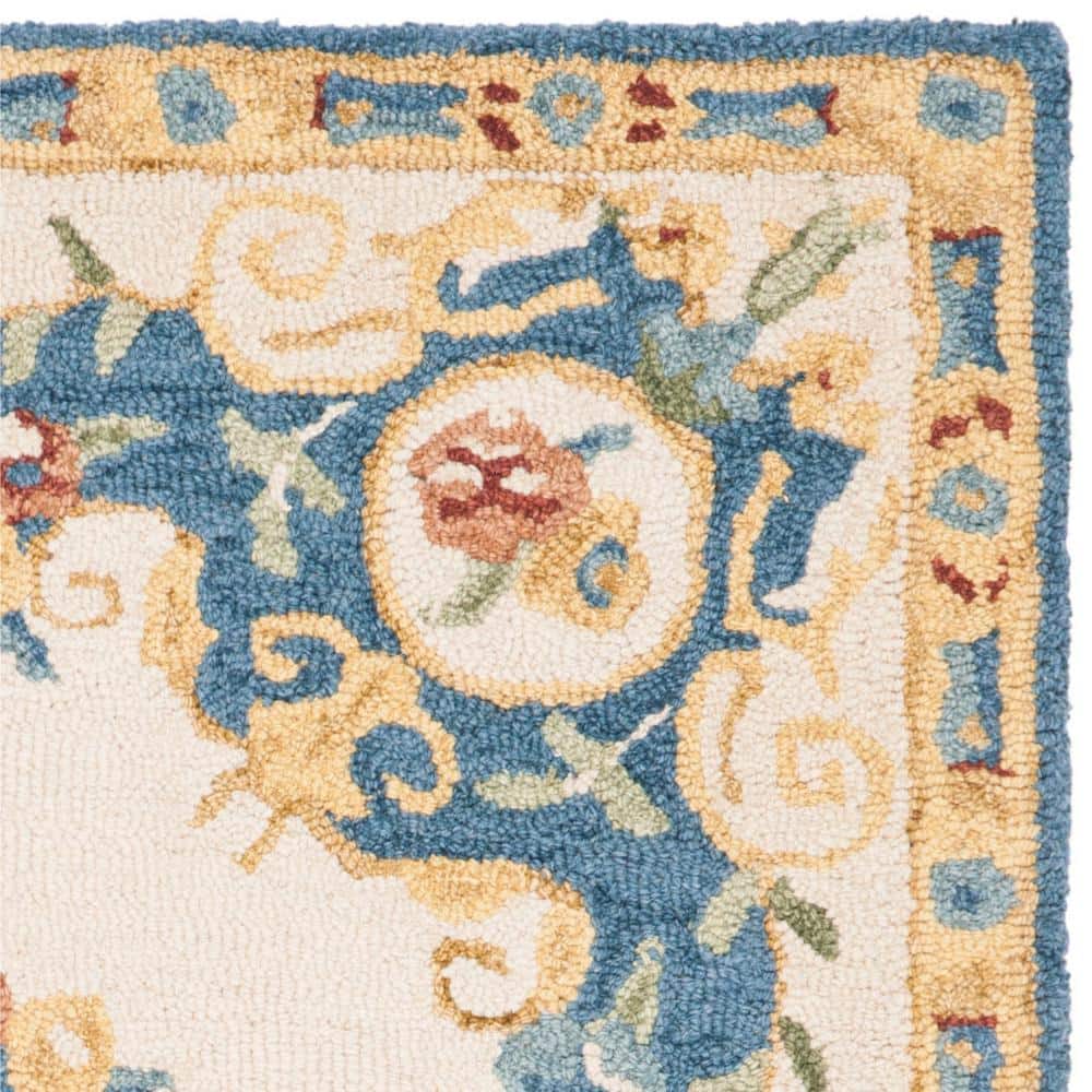 Handmade Cream and Blue Floral Wool Area Rug