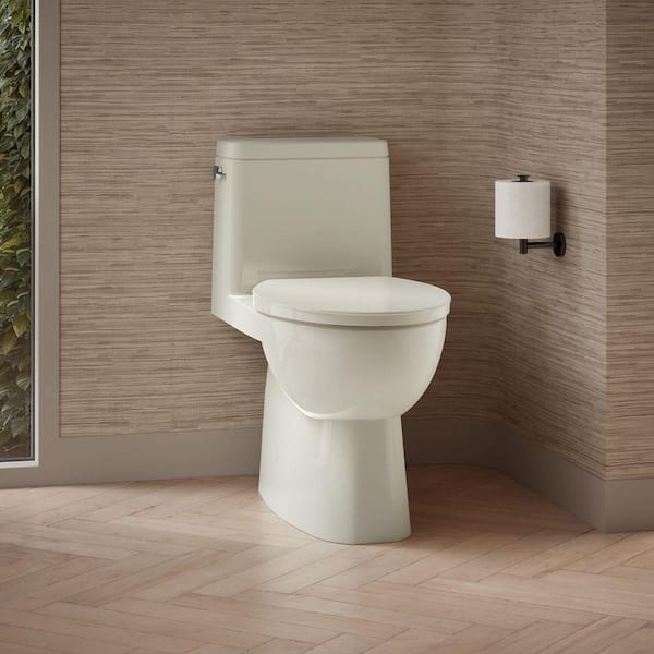 Reach 12 inch 1-piece 1.28 GPF Single Flush Elongated Toilet in Biscuit Seat Included