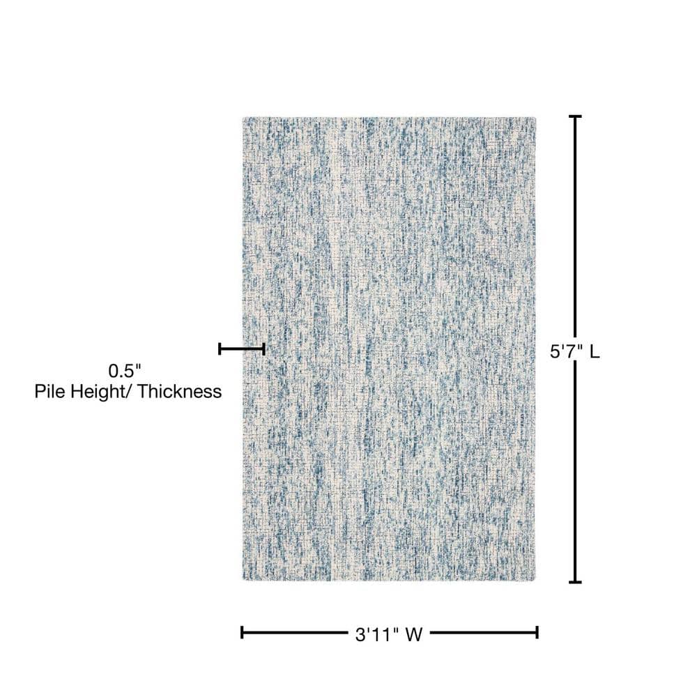 Ivory and Navy Abstract Wool 4' x 6' Area Rug