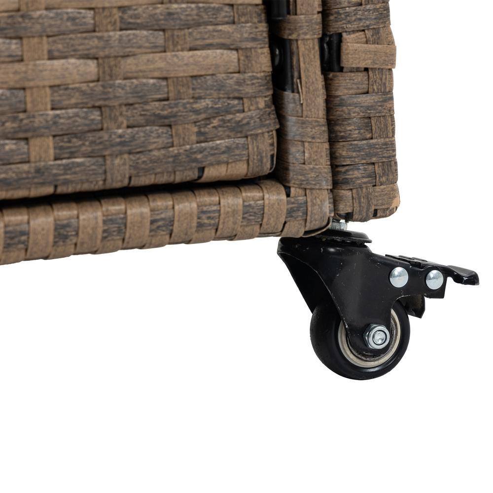 Close-up of a black caster wheel attached to the wicker base of the bar cart.
