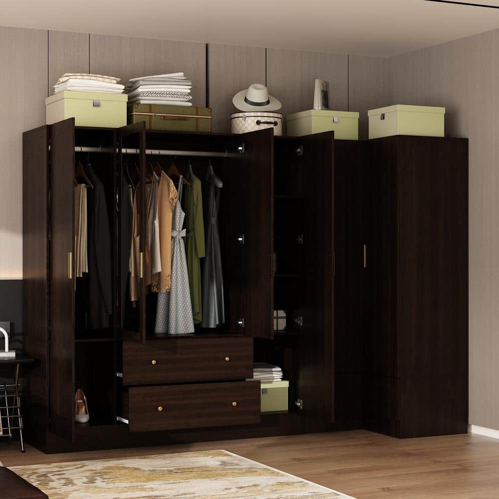 Open dark brown corner wardrobe with clothes on hangers and items on shelves.