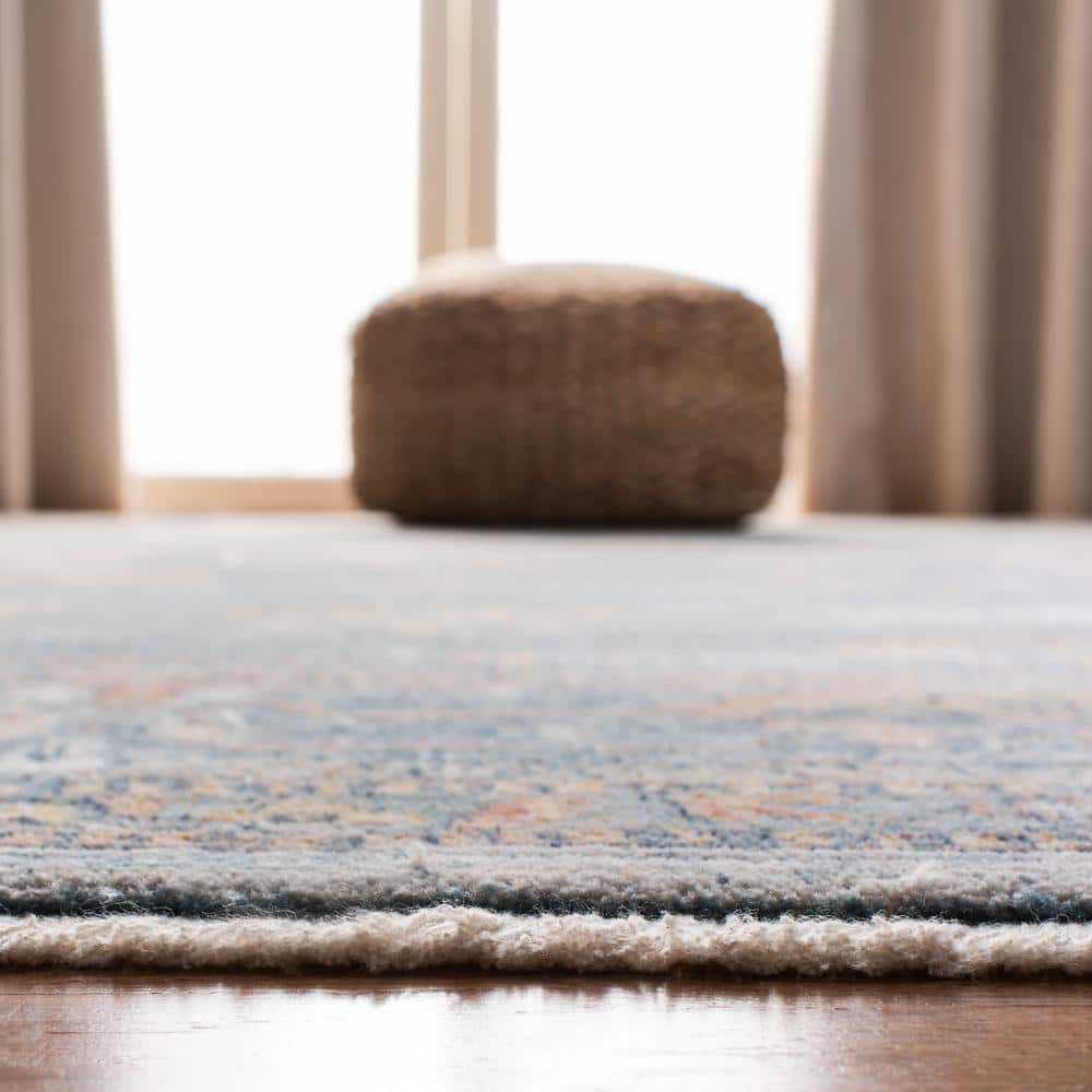 Elegant Blue & Ivory Synthetic 9' x 12' Easy-Care Area Rug