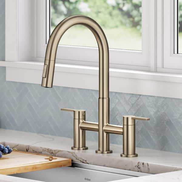 Oletto Double Handle Bridge Kitchen Faucet with Pull-Down Sprayhead in Spot-Free Antique Champagne Bronze