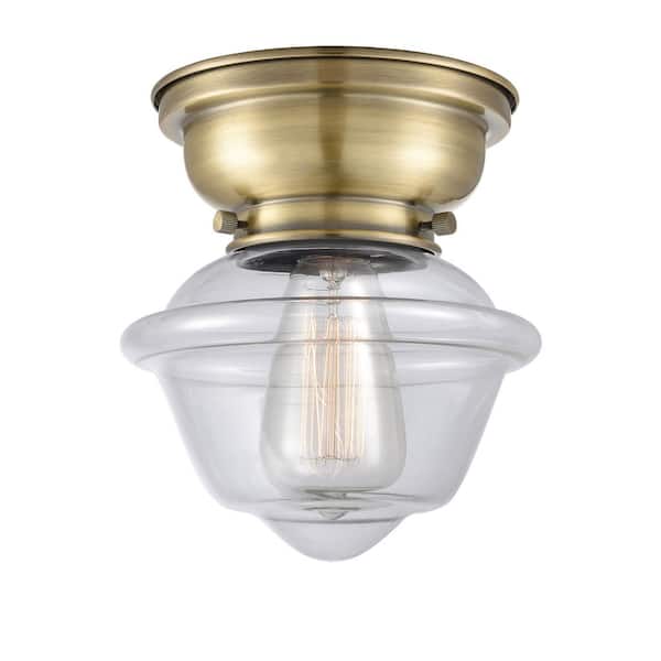 Oxford 7.5 in. 1-Light Antique Brass Traditional Flush Mount with Clear Glass Shade