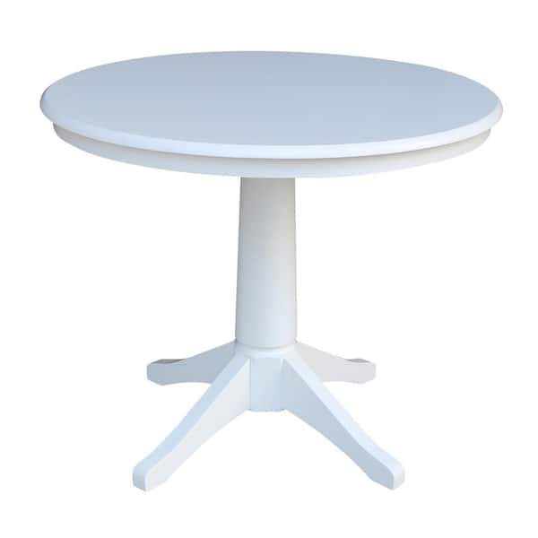 white pedestal outdoor table