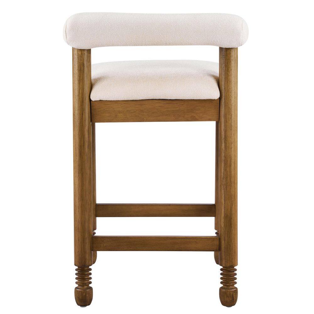 Rear view of a natural wood counter height bar stool with a beige cushioned seat.