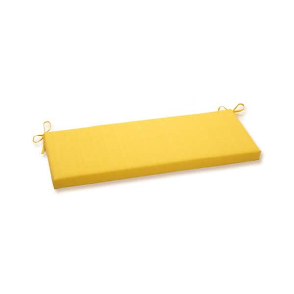 Pillow Perfect Solid Rectangular Outdoor Bench Cushion in Yellow