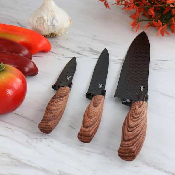 https://images.thdstatic.com/productImages/7e60c4ad-3dd4-417a-b240-1fab1661a75d/svn/oster-knife-sets-985119727m-31_600.jpg