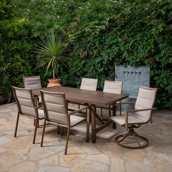 Hanover Fairhope 4 Sling Chairs 2 Sling Swivel Rockers and a 7-Piece Steel Outdoor Dining Set with a 74 in. x 40 in. Table, Tan