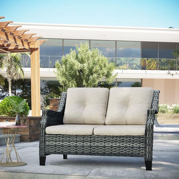 Brown Wicker Outdoor Patio Loveseat with Beige Cushions