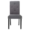 Front view of a gray upholstered dining chair with button-tufted back and black legs.