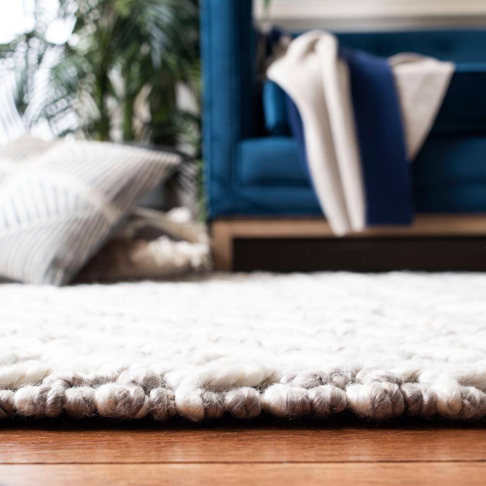 Ivory and Beige Braided Wool Area Rug, 5' x 8'