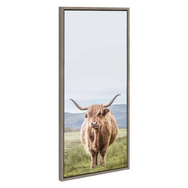 Kate and Laurel Sylvie Highland Cow Mountain Landscape by The Creative Bunch Studio Framed Art Print 18 in. x 40 in.