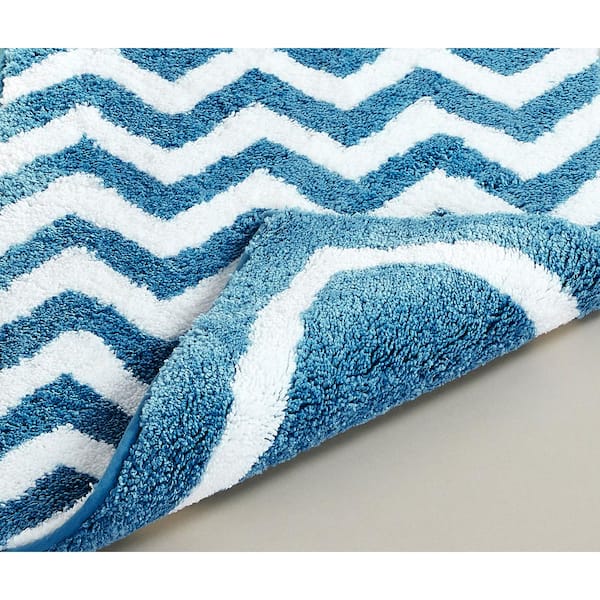 https://images.thdstatic.com/productImages/7f3fe628-9c7c-4176-a25f-d0db5910a425/svn/aqua-better-trends-bathroom-rugs-bath-mats-bape1724aq-66_600.jpg