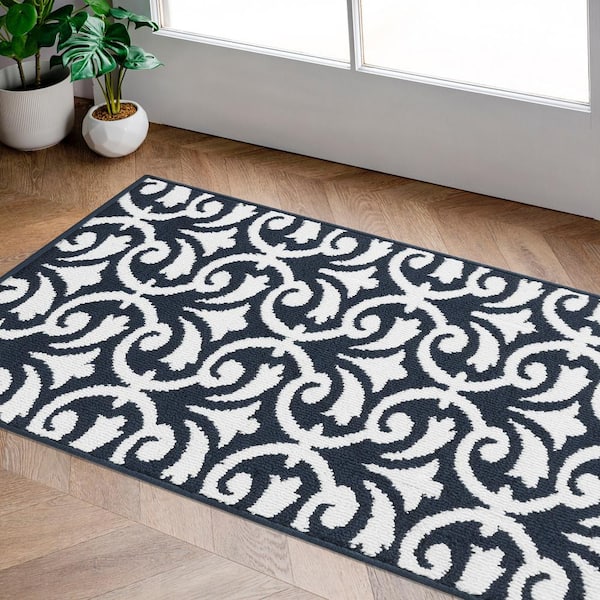 https://images.thdstatic.com/productImages/7f69d758-1348-54f4-9ff8-948c29450695/svn/navy-and-white-jean-pierre-area-rugs-yma016672-31_600.jpg