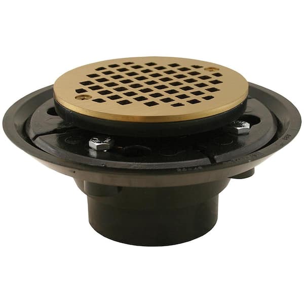 JONES STEPHENS 2 in. x 3 in. ABS Shower Drain/Floor Drain w/4 in. Polished Brass Cast Round Strainer-Fits Over 2 in. Sch. 40 DWV Pipe