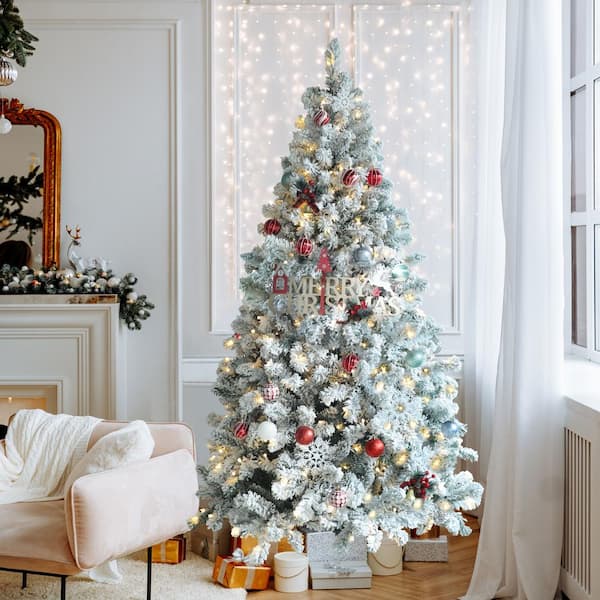 Flocked white Christmas tree with all white and silver decorations