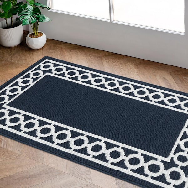 https://images.thdstatic.com/productImages/8033c021-2b4e-5e92-91c1-5d8952d59d5b/svn/navy-and-white-jean-pierre-area-rugs-yma016656-31_600.jpg