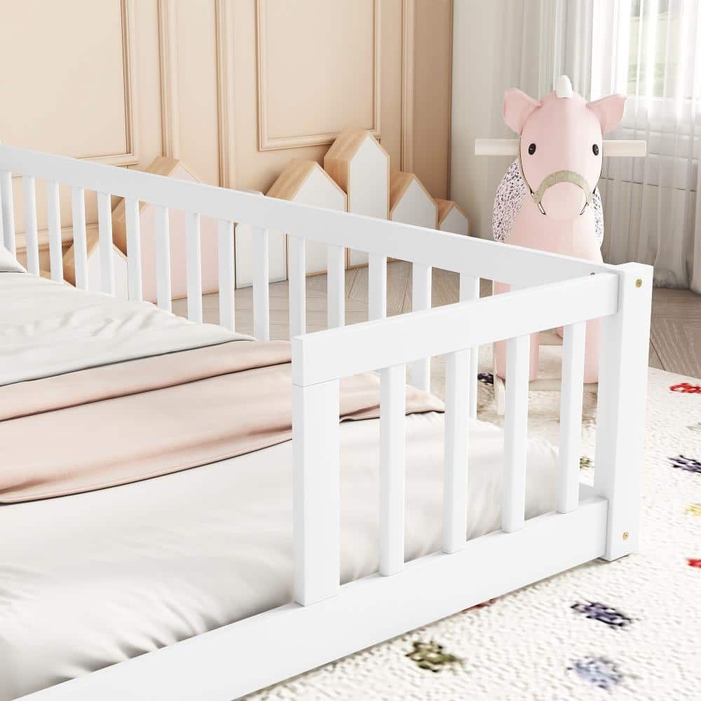 White pine bed frame in a nursery setting with pink decor.