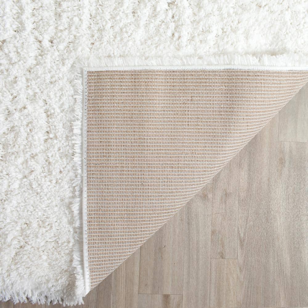 SAFAVIEH Indie Shag White 2 ft. x 7 ft. Solid Runner Rug SGI320C-27
