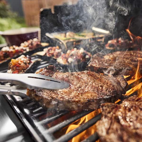 Genesis E-415 4-Burner Liquid Propane Gas Grill in Black with Full Size Griddle Insert