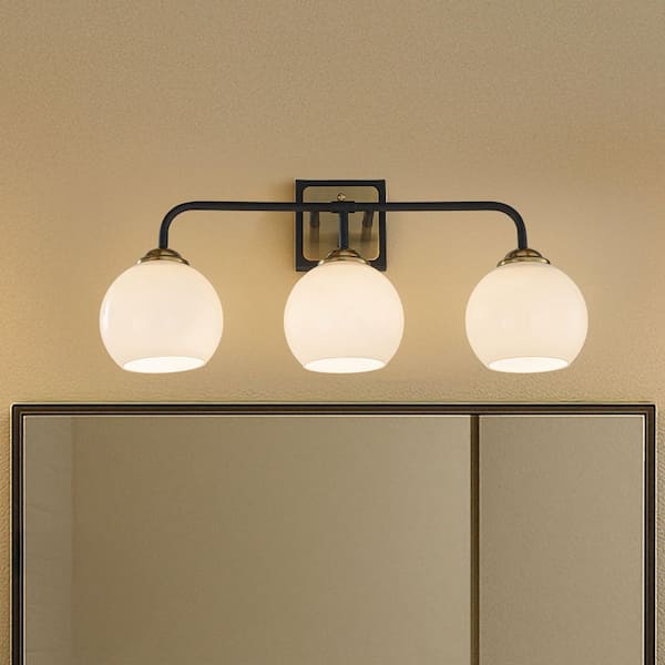 22 in. 3-Light Modern Elegant Brass And Black Bathroom Vanity Light with Round Milk White Glass Shades
