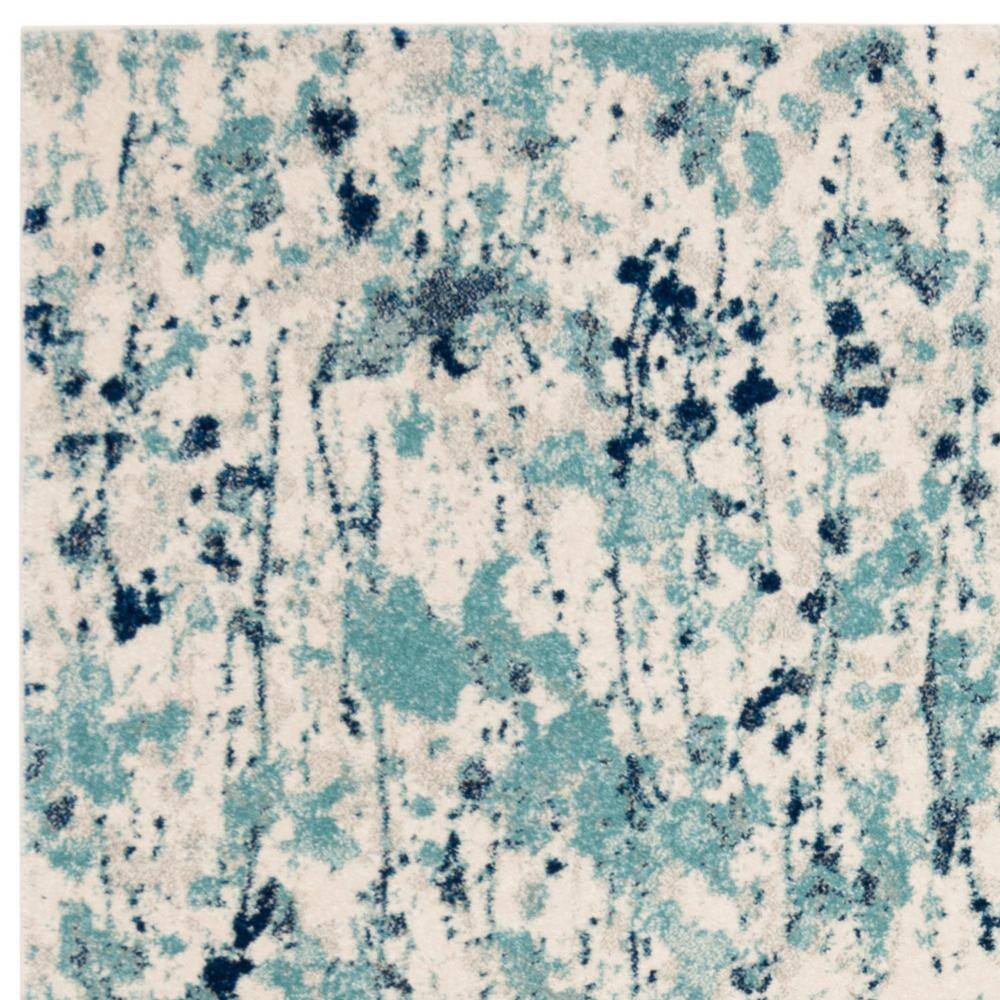 Ivory and Blue Abstract Floral 8' x 10' Area Rug
