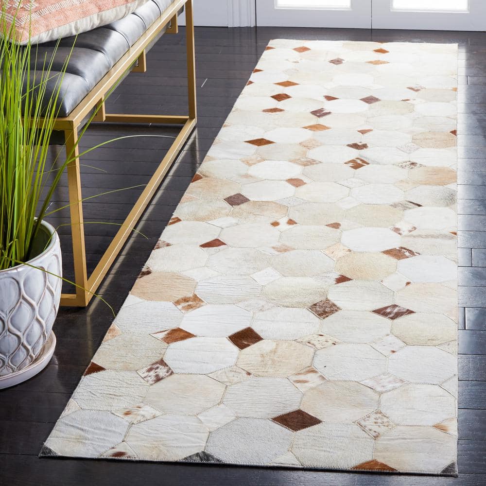 Hand-Stitched Ivory and Brown Geometric Cowhide Rug - 2'3" x 9'