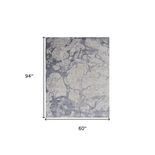 5 ft. X 8 ft. Ivory and Blue Abstract Area Rug