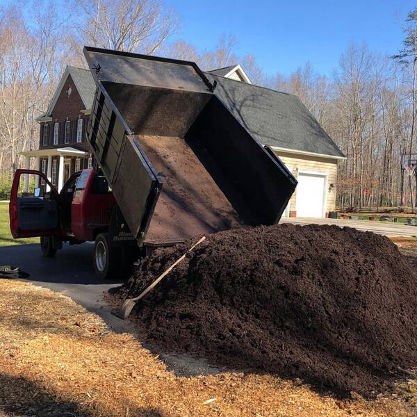 Image of Delivery truck parked in yard with bulk mulch